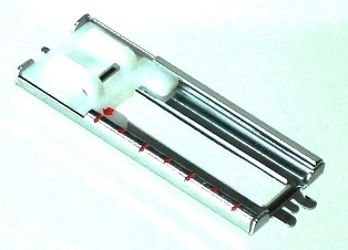 Knapphålsfot med glidskena